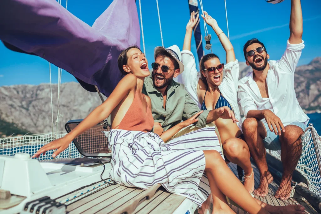 Friends laughing together on a sailing holiday in Greece