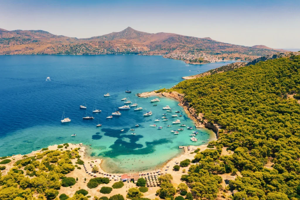 Aerial view of a bay with anchored yachts at Moni island, Saronic Gulf
