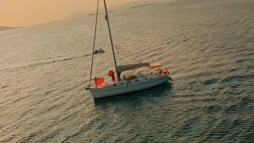 Aerial view of a sailing yacht in the Saronic Gulf, from the Punto film