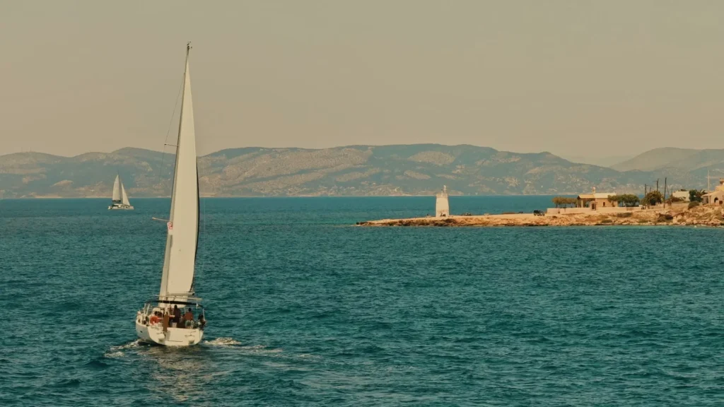 Sailing under full sail with guests on the bow