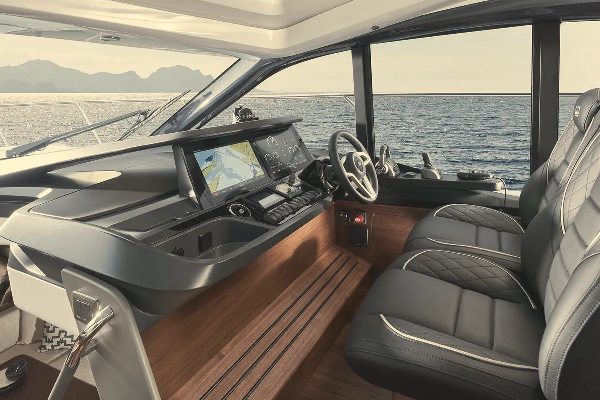 Helm station and seats inside a motor yacht